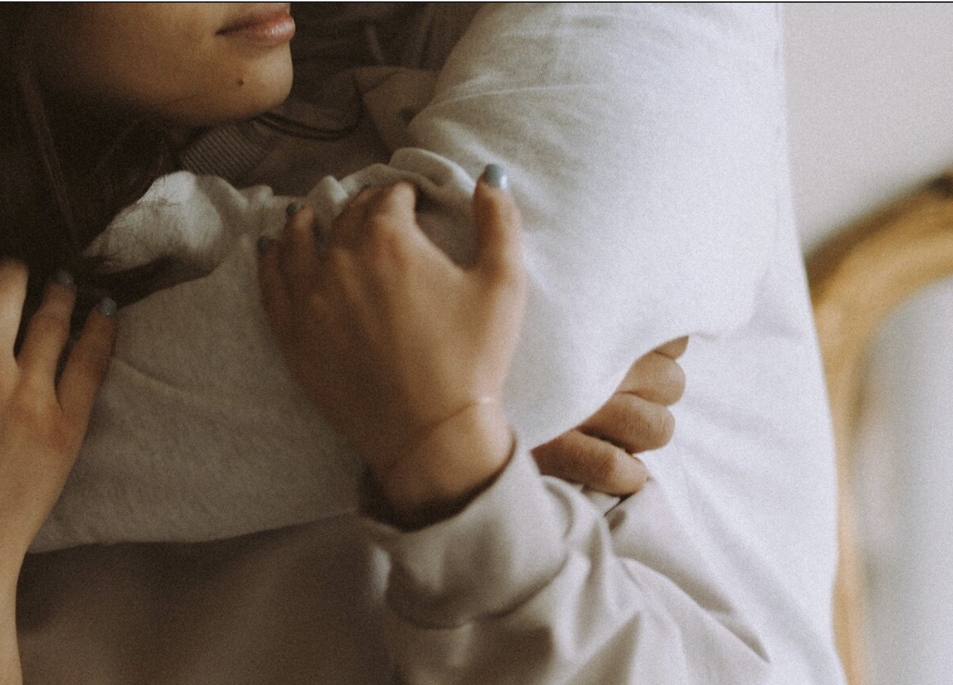 Two people holding each other closely in soft daylight